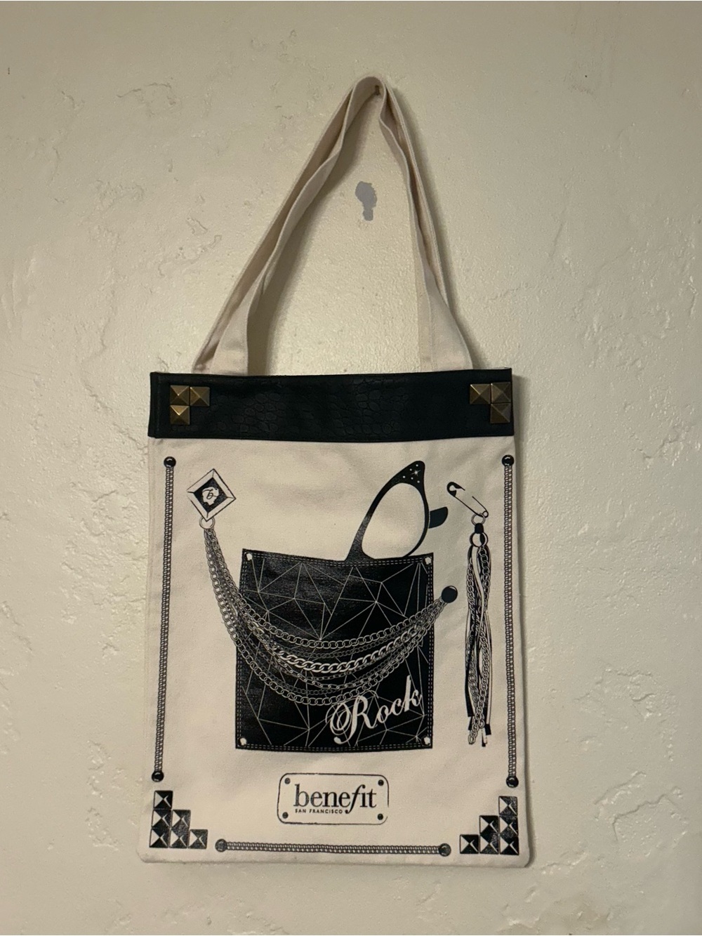 Benefit Cream and Black Graphic Tote Bag with Stud Accents